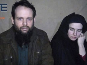 This undated militant file image from video posted online in August 2016, which has not been independently verified by The Associated Press, provided by SITE Intel Group, shows Canadian Joshua Boyle and American Caitlan Coleman, who were kidnapped in Afghanistan in 2012.