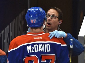 Edmonton Oilers captain Connor McDavid gets attended to after getting a stick in the face against the Columbus Blue Jackets during the first period of NHL action at Rogers Place on Dec. 13, 2016. (Ed Kaiser/Postmedia)