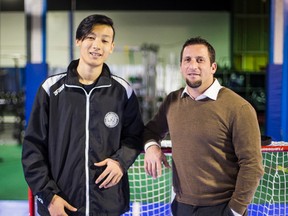 Noah Li (left), a hockey player from Beijing, China, and Neil Doctorow, Director of Development, Blyth Academy, pose for a photo at Blyth Academy Downsview Park - School for Elite Athletes in Toronto on Tuesday, Dec. 20, 2016. (Ernest Doroszuk/Toronto Sun)