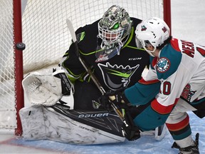 OIl Kings goaltender Patrick Dea, shown here stopping a shot by a Kelowna Rockets player on Monday, says the players on the team are upbeat heading into the Christmas break. (Ed Kaiser)