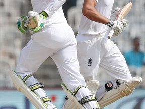 England’s captain Alastair Cook (right) and Keaton Jennings run between the wickets during their fifth day of the fifth cricket test match against India in Chennai, India. (AP)