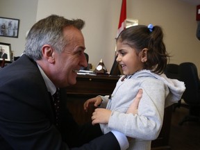 Jason Miller/The Intelligencer.
Five-year-old Halizan Hachi meets Bay of Quinte MP Neil Ellis Wednesday. She and her parents Kanver and Shama Hachi arrived in Belleville from Syria, via Turkey, last week.