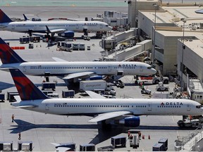 Delta Airlines jets are pictured at a terminal at Los Angeles International Airport (LAX) on Sept. 4, 2013. (THE CANADIAN PRESS/AP, Reed Saxon)