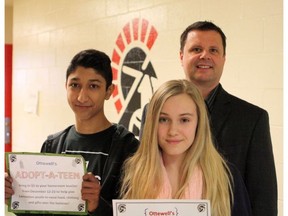 Rajan Maghera, 14, (left) and Sophia Wojdak, 14, (centre) both students from Ottewell Junior High School in Edmonton stand with Ottewell Junior High School principal Ron Thompson (right) after students raised nearly $1,400 for the Edmonton Sun Adopt-A-Teen 2016 campaign.
Photo by Claire Theobald