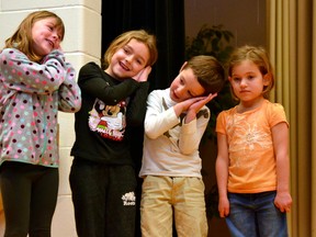 During St. Patrick's School in Kinkora's annual Christmas Concert Dec. 21, the junior and senior kindergarten classes sang Away in a Manger. Pictured from left, Emily Van Herk, Peyton Ward and Andrew Frustaci enthusiastically performed the dance their classes had practiced to go with the song, while Jessika Phillips wasn't quite as excited to join in on the fun. GALEN SIMMONS MITCHELL ADVOCATE