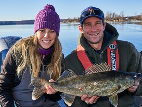 Columnist Ashley Rae, left, and Herman Westendorp with a 7.38-pound walleye he caught and released on the Bay of Quinte. (Supplied photo)