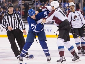 Avalanche's Nikita Zadorov (right) fights with Maple Leafs left wing Matt Martin during second period NHL action in Toronto on Sunday, Dec. 11, 2016. (Chris Young/The Canadian Press)