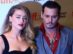 Johnny Depp with his then-wife Amber Heard on the red carpet for movie "Black Mass" during the Toronto International Film Festival in Toronto on Friday September 11, 2015. (Dave Abel/Toronto Sun/Postmedia Network)