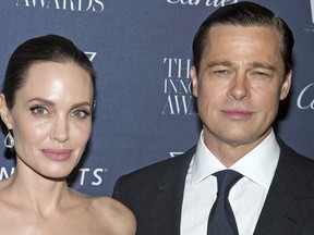 This Nov. 4, 2015 file photo shows Angelina Jolie Pitt and Brad Pitt at the WSJ Magazine Innovator Awards 2015 at The Museum of Modern Art in New York. (Charles Sykes/Invision/AP, File)