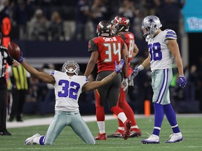 Orlando Scandrick of the Dallas Cowboys celebrates an interception during Sunday's game against the Tampa Bay Buccaneers at AT&T Stadium in Arlington, Tex. (Ronald Martinez/Getty Images)