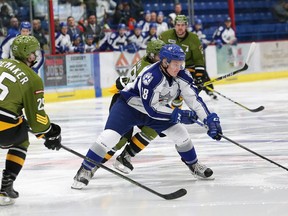 Macauley Carson, right, of the Sudbury Wolves, breaks in on the net against the North Bay Battalion, during OHL action at the Sudbury Community Arena in Sudbury, on Friday December 2, 2016. Carson's tremendous play in the first half of the OHL season has caught the eye of head coach Dave Matsos. John Lappa/Sudbury Star/Postmedia Network