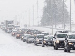 Traffic backed up along northbound Woodroffe Avenue during a snowstorm in Ottawa. Monday December 5, 2016.
