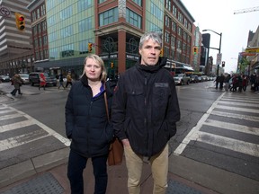 Poverty researchers Tracy Smith Carrier and Don Kerr, stand at Dundas and Richmond streets, the location of an Ontario Works office in downtown London. New information shows the rate of people on social assistance in the wider London area has far outstripped its population growth rate over the past decade. (CRAIG GLOVER, The London Free Press)