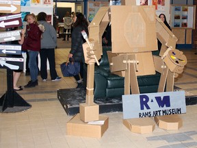 GC Cardboard (robot's name), made entirely out of cardboard by the arts and graphics crew on the Robotics team, welcomed guests to the R.A.M. night.