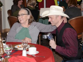 Lena Holowinski hugs Juke Box Lee as he sings to residents. - Photo by Marcia Love