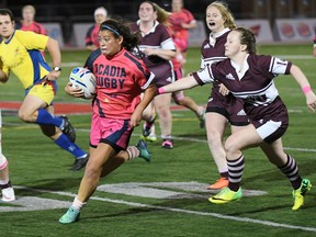 Kingston's Annie Kennedy of the Acadia Axewomen carries the ball during an Atlantic University Sport women's rugby game this fall. (Peter Oleskevich/Supplied photo)
