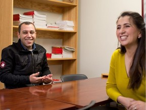 New Syrian Refugee Abdullatif Abdul Karam describes dealing with Calgary's cold snap with the help of interpretation by the Calgary Catholic Immigration Society's Rima Jacob on Monday December 12, 2016. Abdullatif his wife Ebtisan Alawa and four children escaped from Aleppo in 2013 and have been bounced around several countries in the Middle East always with the hope of making it to Canada. They arrived in late November. The Calgary Catholic Immigration Society has helped them since they arrived. (GAVIN YOUNG/Postmedia Network)