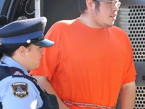 Nathan Koostachin is seen here being escorted inside the courts in Timmins for his scheduled appearance in Timmins provincial court Tuesday, July 26, 2016. Koostachin, who is facing a first-degree murder charge in connection with the death of Austin Theriault, was denied bail on Friday morning.