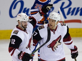 Coyotes' Steve Downie (right) celebrates his goal with teammate Brad Richardson (left) against the Oilers during first period NHL action in Edmonton on Jan. 2, 2015. (Greg Southam/Postmedia Network/Files)