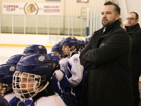 Shawn Frappier, head coach of the AAA Sudbury Wolves Minor Midgets, yells out instructions during a hockey game at McClelland arena in Copper Cliff, Ont. on Friday December 23, 2016. John Lappa/Sudbury Star/Postmedia Network