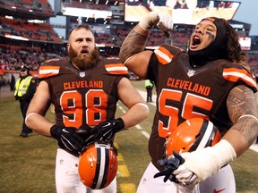 Browns nose tackle Danny Shelton (55) and Jamie Meder (98) celebrate after their first win of the season over the Chargers in Cleveland on Saturday, Dec. 24, 2016. (Ron Schwane/AP Photo)