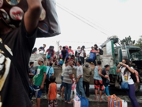 Stranded passengers from Tabaco port are evacuated by the local government in Tabaco City, Albay province on December 24, 2016 after their seafaring vessels were prohibited from sailing ahead of typhoon Nock-Ten's expected arrival. Philippine authorities began evacuating thousands of people and shut down dozens of ports on December 24 as a strong typhoon threatened to wallop the country's east coast on Christmas Day. Nock-Ten is expected to be packing winds of between 203-250 kilometres per hour (126-155 miles per hour) when it crosses over Catanduanes, a remote island of 250,000 people in the Bicol region, late Sunday, the US Joint Typhoon Warning Center said. (CHARISM SAYAT/AFP/Getty Images)