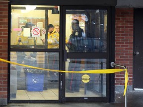 Toronto Police investigate a fatal stabbing inside a hallway at 200 Sherbourne St. on Dec. 24, 2016. (John Hanley/Toronto Sun)