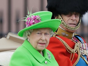 In this Saturday, June 11, 2016 file photo, Queen Elizabeth and Prince Philip ride in a carriage during the Trooping The Colour parade at Buckingham Palace, in London.  (AP Photo/Tim Ireland, file)