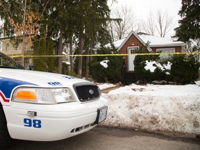 London police remain on the scene at 56 Duchess Ave. in south London where Samuel Maloney died after a confrontation with police Friday morning, when he shot at an officer with a crossbow in London, Ont. (MIKE HENSEN, The London Free Press)