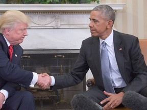 U.S. President Barack Obama (R) shakes hands as he meets with Republican President-elect Donald Trump on transition planning in the Oval Office at the White House on Nov. 10, 2016 in Washington, D.C.  (JIM WATSON/AFP/Getty Images)
