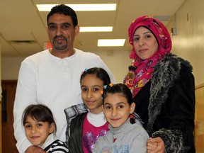 Mohammed Al-Khaleel, his wife, Diana, and their three children, from left, Rahaf, Rooal, and Raghad, are pictured together at the YMCA Learning and Career Centre on Oakdale Avenue on Friday January 8, 2016 in Sarnia, Ont. They were the first family of Syrian refugees to arrive in the city. File photo/Sarnia Observer/Postmedia Network