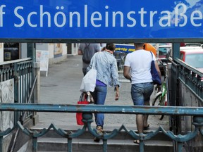 In this July 19, 2010 file picture people leave the Schoenleinstrasse subway station in Berlin. (Tobias Kleinschmidt/dpa via AP,file)