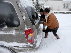 The cleanup from the winter storm continued on Tuesday. (CHRIS PROCAYLO/WINNIPEG SUN)