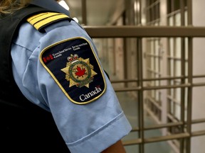 A correctional officer watches over the maximum security unit during a tour of the Collins Bay Institution on Tuesday May 10 2016. Ian MacAlpine /The Whig-Standard/Postmedia Network