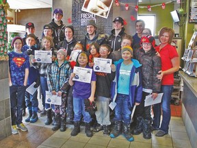 Pictured are the Eldorado School students with their mentors from the Drayton Valley Thunder hockey team.