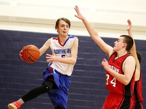 Gino Donato/Sudbury Star
Sudbury Secondary North Stars' Jake Myre goes to make a pass as S. Samure of Champlain attempts to block it during senior boys basketball action on Mon., Dec. 12. The North Stars are off to a great start to the season at 4-0.