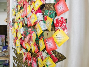 The quilted Tree of Hope hangs in the Pincher Creek Health Centre as it collects yellow memorial and red tags offering best wishes for the holiday. All proceeds and donations go towards funding Windy Slopes’ initiatives. | Caitlin Clow photo/Pincher Creek Echo