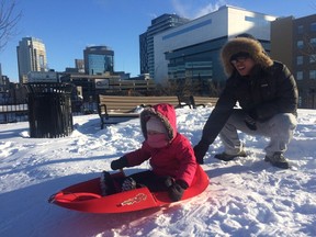 Bo Wu sledding with his two-year-old daughter Fiona at Central Park in Winnipeg on Tuesday, Dec. 27, 2016.
DEAN PRITCHARD/Winnipeg Sun/Postmedia Network