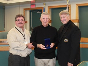 Corunna's Lyle Lalonge received the Governor General's Sovereign's Medal for Volunteers at a brief ceremony during St. Clair Township council's Dec. 19 meeting. Left to right: The Inn of the Good Shepherd's Myles Vanni, Lyle Lalonge, St. Clair Township Mayor Steve Arnold.
CARL HNATYSHYN/SARNIA THIS WEEK