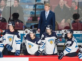 Finland coaches and players look on from the bench during the closing seconds of a IIHF World Junior Championship game against Denmark in Montreal on Dec. 27, 2016. (THE CANADIAN PRESS/Graham Hughes)