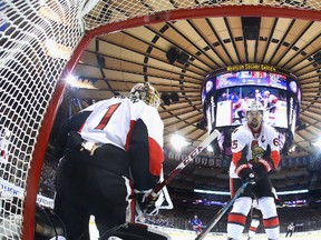 Mike Condon and Erik Karlsson of the Ottawa Senators pause following a goal by the New York Rangers at Madison Square Garden on Dec. 27, 2016. (Bruce Bennett/Getty Images)
