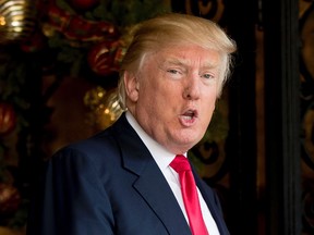 In this Dec. 21, 2016, file photo, President-elect Donald Trump speaks to members of the media at Mar-a-Lago, in Palm Beach, Fla. (AP Photo/Andrew Harnik, File)