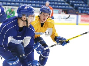 Sudbury Wolves forward Michael Pezzetta (right) and defenceman Zack Wilkie run through a drill during team practice in Sudbury, Ont. on Wednesday December 28, 2016. Pezzetta is returning to the lineup on Friday after a 10 game suspension.Gino Donato/Sudbury Star/Postmedia Network