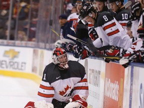 Team Canada goalie Connor Ingram is greeted with smiles as he slides into the bench on a delayed penalty call as Canada plays Slovakia in world juniors action on Dec. 27, 2016. (Michael Peake/Toronto Sun/Postmedia Network)