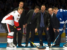 Ex-Senators captain Daniel Alfredsson and then-Maple Leafs counterpart Dion Phaneuf (now a Senator) take part in the 2011 Hockey Hall of Fame game in Toronto. They took the faceoff with inductees (left to right) Joe Nieuwendyk, Doug Gilmour, Ed Belfour and Mark Howe. (Jack Boland, Postmedia Network file)