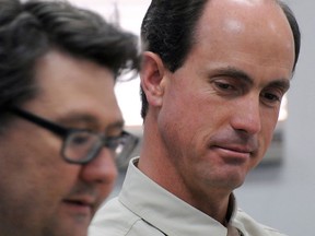 In this July 9, 2015 file photo, Seth Jeffs, right, brother of imprisoned polygamous sect leader Warren Jeffs, participates in a state water board meeting in Pierre, S.D. (AP Photo/James Nord, File)