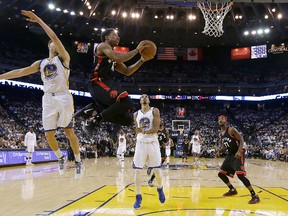 Toronto Raptors guard DeMar DeRozan shoots against Golden State Warriors guard Klay Thompson (11) during the second half of an NBA basketball game in Oakland, Calif., Wednesday, Dec. 28, 2016. (AP Photo/Jeff Chiu)