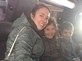 Lucien Nadeau, right, is pictured here with his mother Jessica and his sister Vivienne during their limo ride home to Sarnia from a London hospital Dec. 23. A group of supporters organized the special ride for the five-year-old Sarnia boy who is battling brain cancer. Handout/Sarnia Observer/Postmedia Network