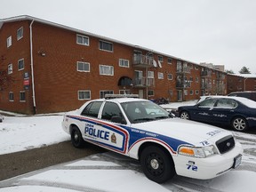 London police remain at the scene of a Wednesday night shooting that left a 26-year-old man dead. Morris Lamont/The London Free Press/Postmedia Network
