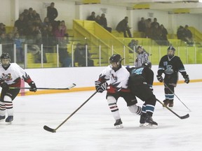 Vulcan Hawks bantam player Jaxson Slocombe takes charge of the puck before a Coaldale Cobras player does during a game Dec. 16 at the Vulcan District Arena.